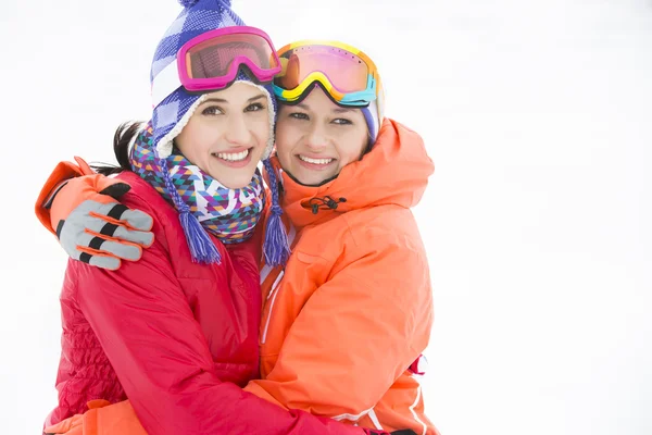 Women in warm clothing embracing — Stock Photo, Image