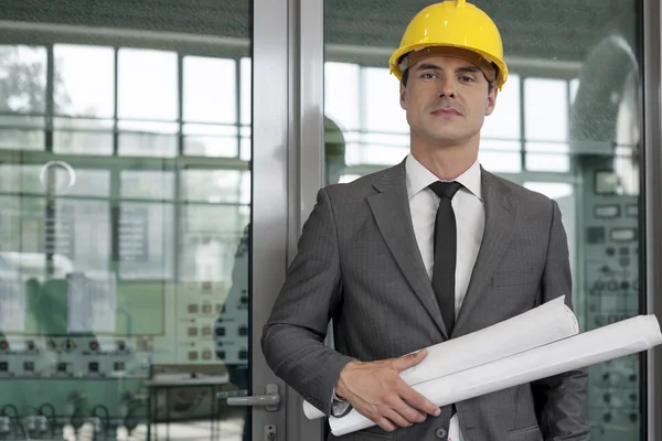 Architect holding blueprints — Stock Photo, Image