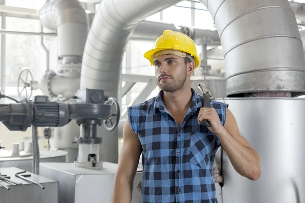 Worker holding wrench — Stock Photo, Image