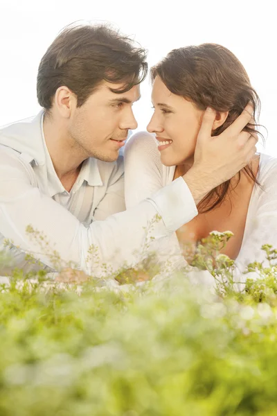 Man touching woman while looking at her — Stock Photo, Image