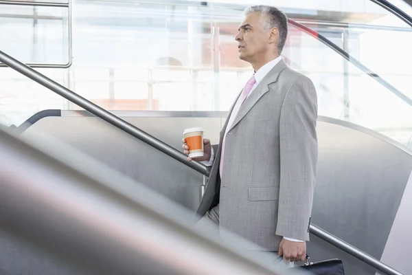 Businessman  walking up stairs — Stock Photo, Image