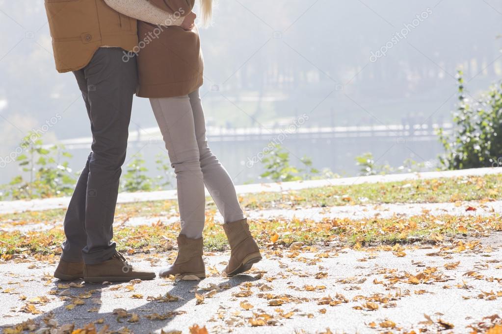 Couple standing in park
