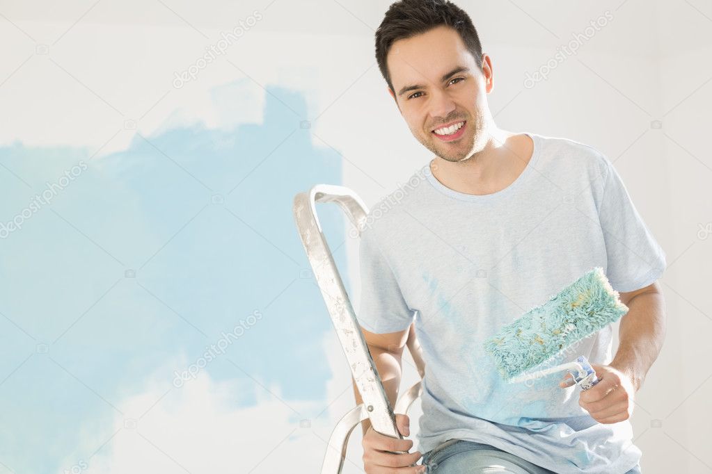 man painting his new house