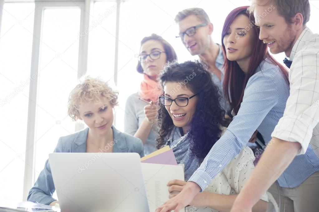 businesspeople using laptop