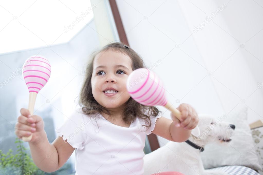 Girl playing with maracas