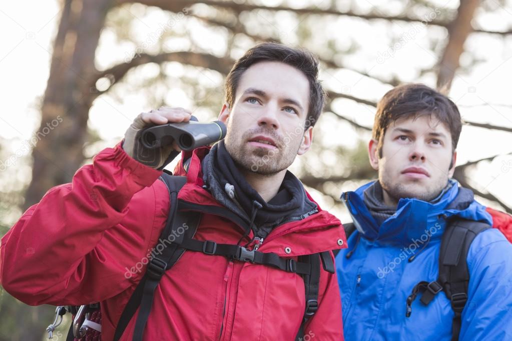 hikers with binoculars standing