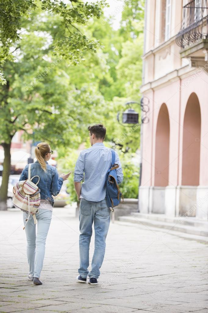 Friends talking while walking