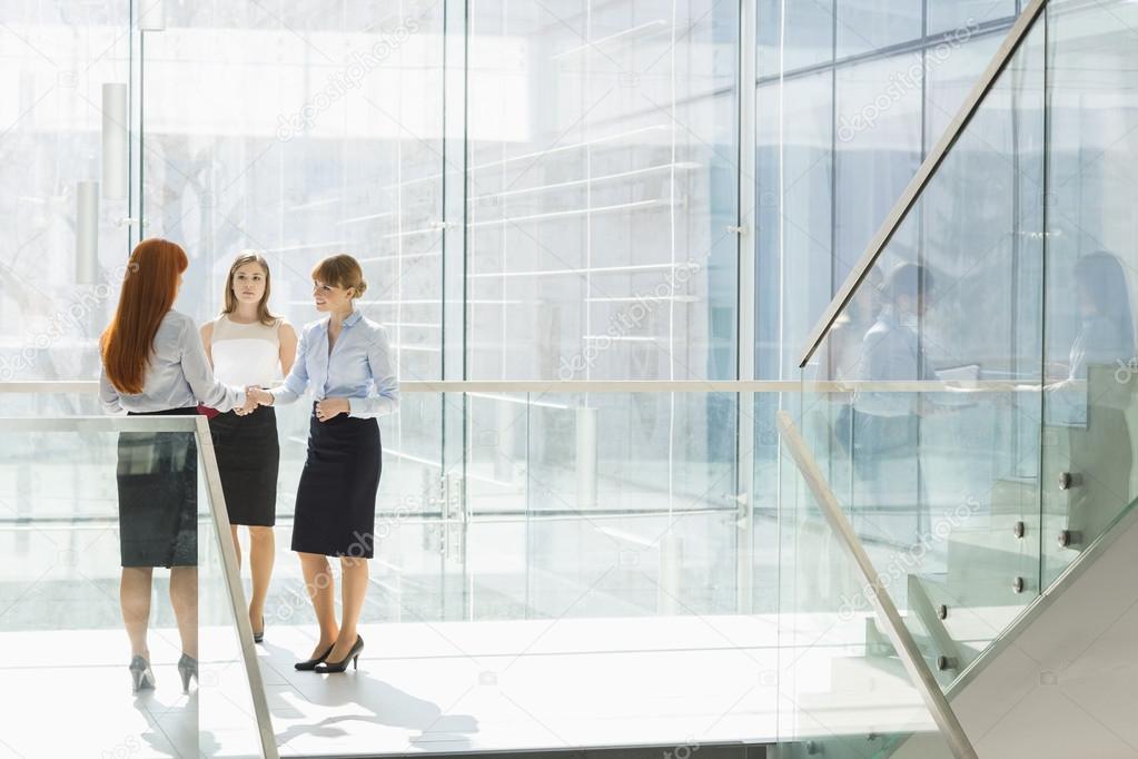 Businesswomen shaking hands