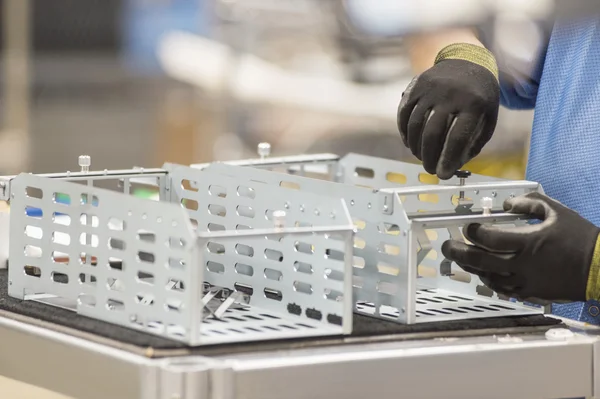 Engineer repairing computer part — Stock Photo, Image