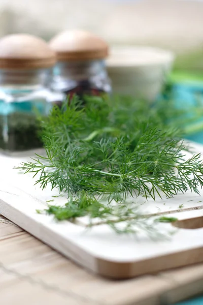 Fresh green dill on chopping board — Stock Photo, Image