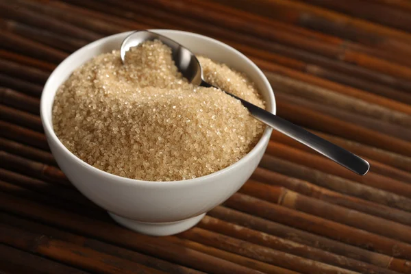 Brown sugar and cup — Stock Photo, Image