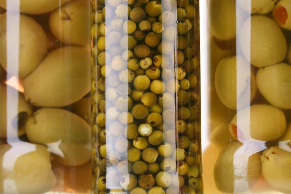 Jars with pickled olives — Stock Photo, Image