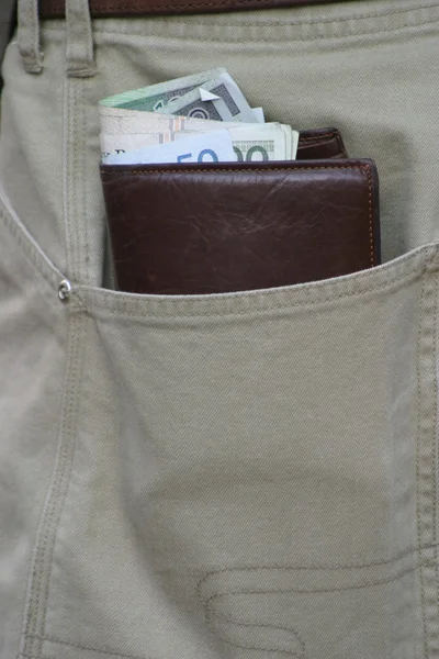 Wallet with money in pocket — Stock Photo, Image