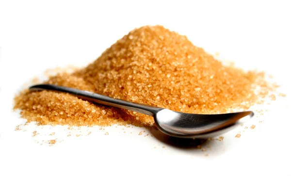 Brown sugar and spoon — Stock Photo, Image