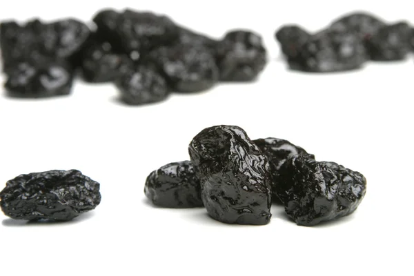 Shot of prunes on white — Stock Photo, Image