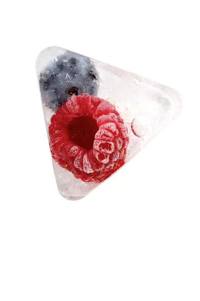 Raspberry and blueberry in ice — Stock Photo, Image