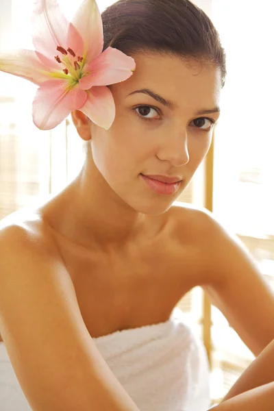 Young woman wrapped in towel — Stock Photo, Image