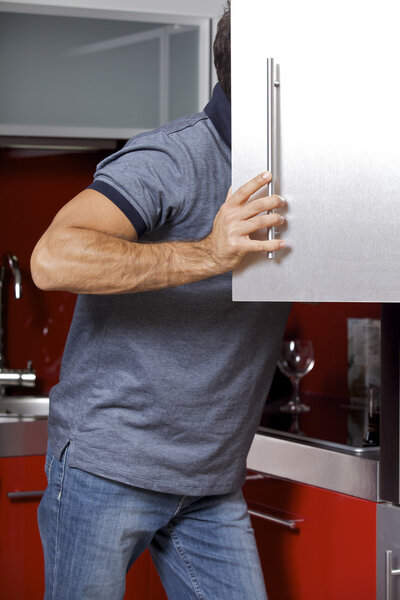 Man looking in refrigerator