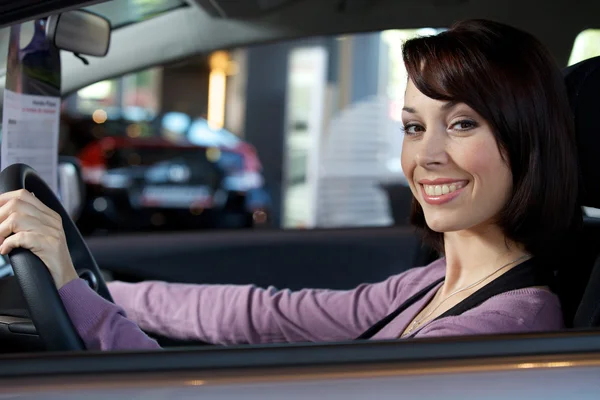 Woman sitting in driver's seat — Stock Photo, Image