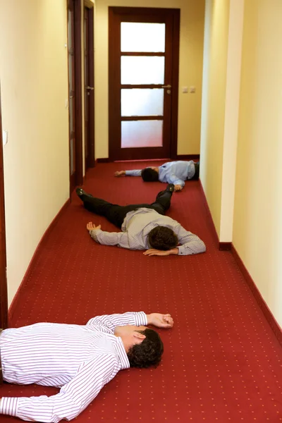 Businessman lying down in office — Stock Photo, Image