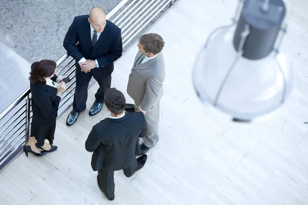 Businessmen and businesswoman standing — Stock Photo, Image