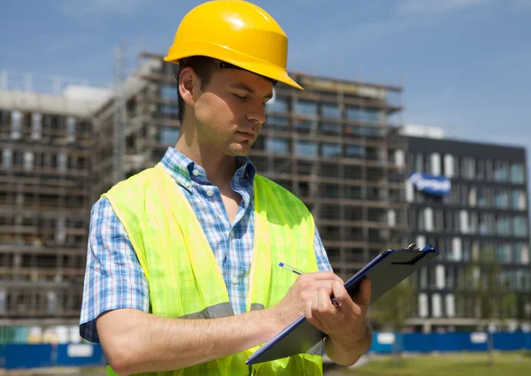 Architect writing on clipboard — Stock Photo, Image