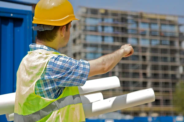 Engineer holding blueprint — Stock Photo, Image