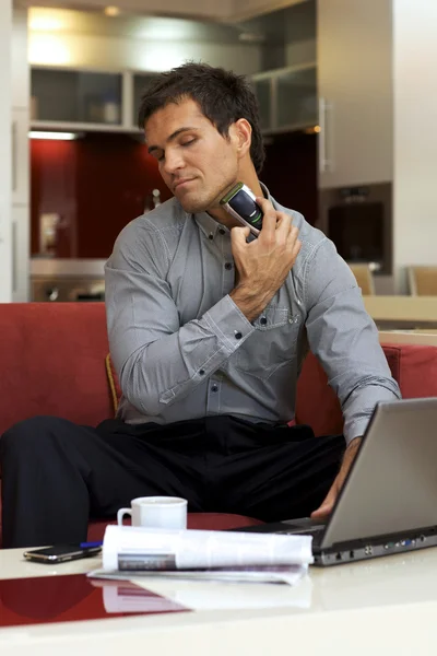 Young man shaving — Stock Photo, Image