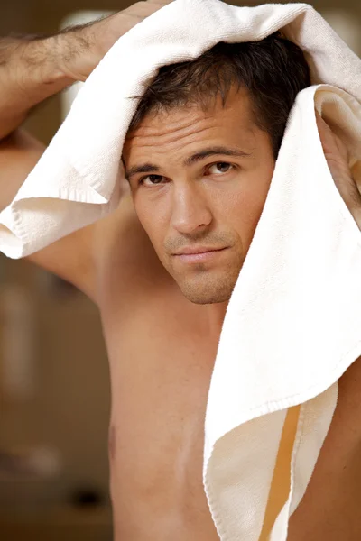 Man drying hair with towel — Stock Photo, Image