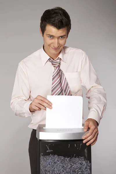 Businessman shredding documents — Stock Photo, Image