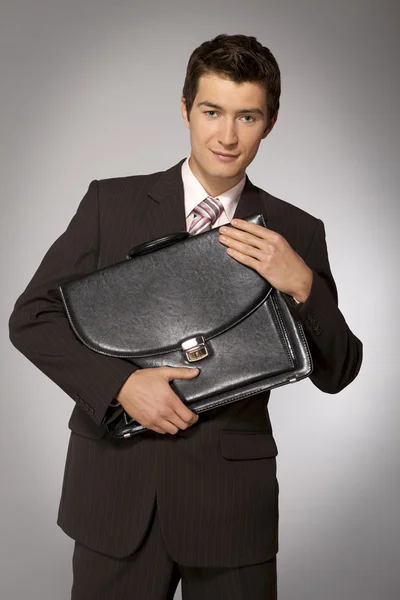 Uomo d'affari in possesso di valigetta — Foto Stock