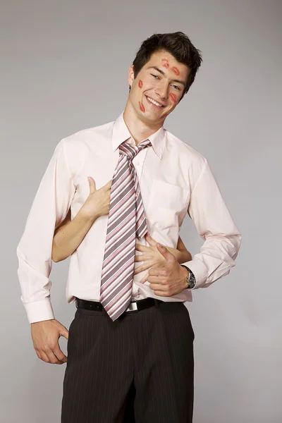 Businessman with kiss marks — Stock Photo, Image