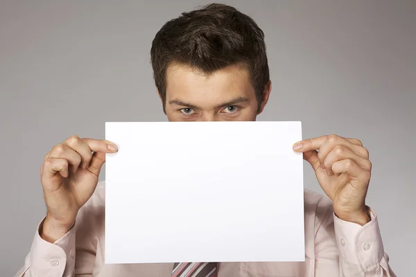 Businessman holding card — Stock Photo, Image