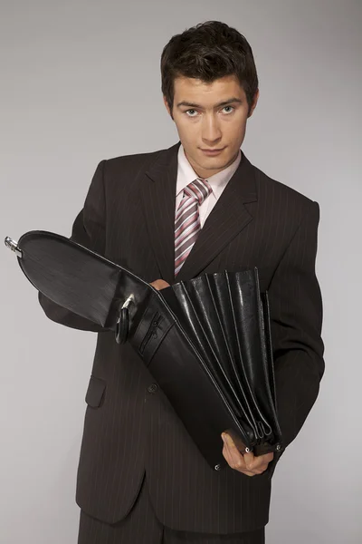 Businessman looking in his briefcase — Stock Photo, Image