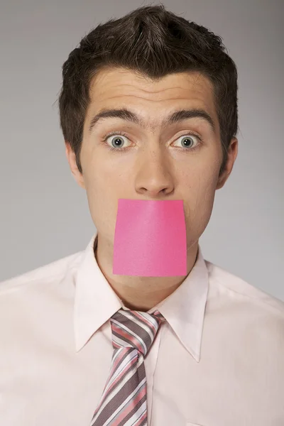 Businessman with censorship card — Stock Photo, Image