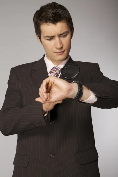 Businessman looking on his watch — Stock Photo, Image