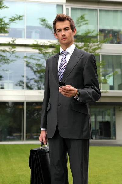 Businessman with cellphone — Stock Photo, Image