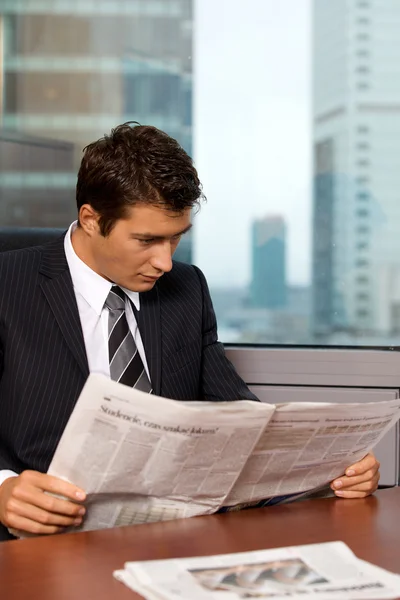 Businessman reading newspaper — Stock Photo, Image