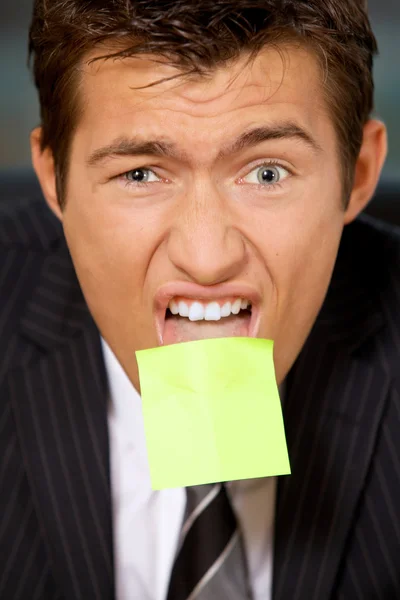 Businessman  with blank adhesive note — Stock Photo, Image