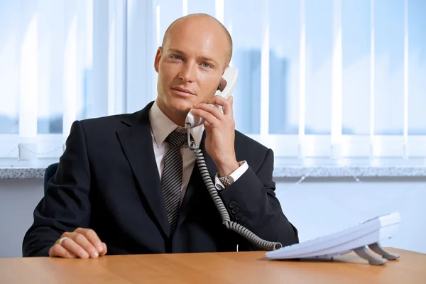 Businessman talking on telephone — Stock Photo, Image