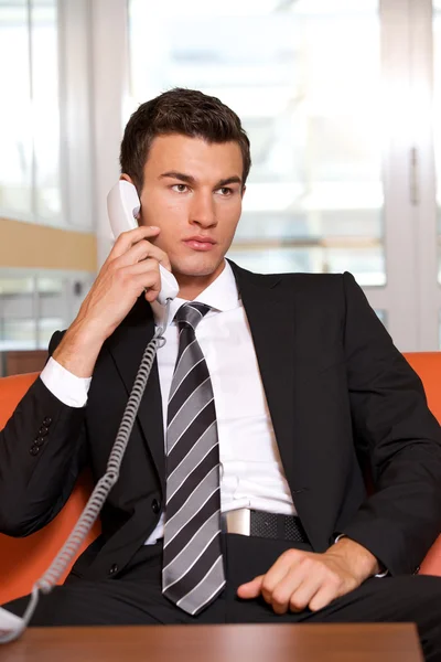 Businessman conversing on  phone — Stock Photo, Image