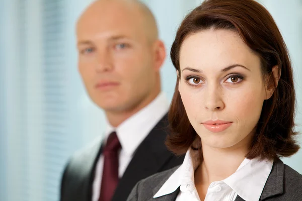 Businessman and businesswoman posing — Stock Photo, Image