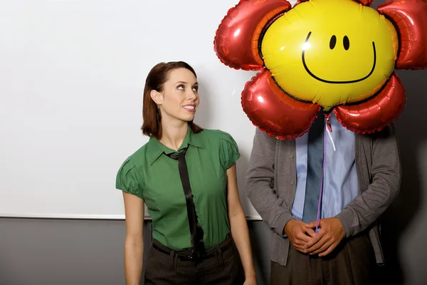 Businesswoman looking at balloon — Stock Photo, Image