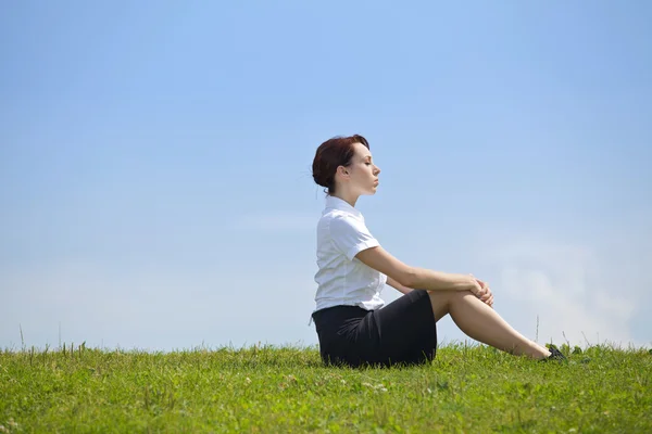 Businesswoman contemplating in park — Stock Photo, Image