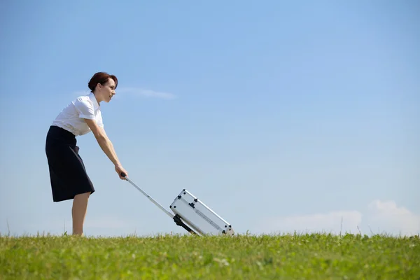Businesswoman holding luggage — Stock Photo, Image