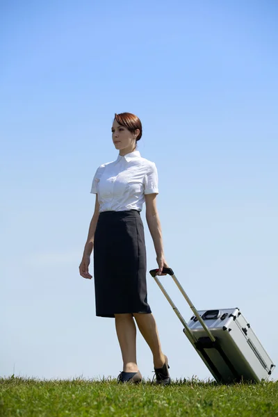 Businesswoman holding luggage — Stock Photo, Image