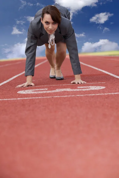 Businesswoman on start line — Stock Photo, Image