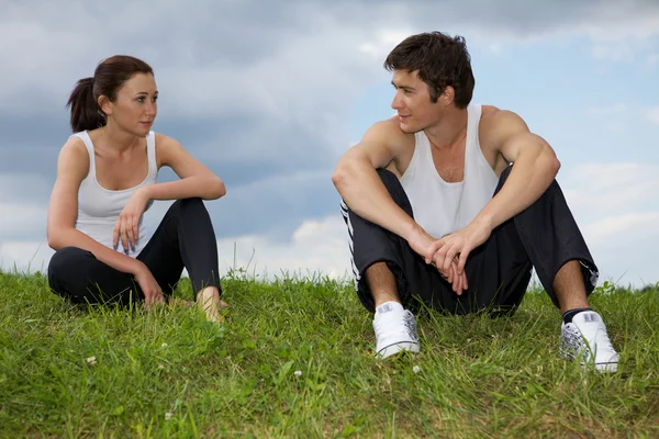 Couple exercising in park Stock Picture