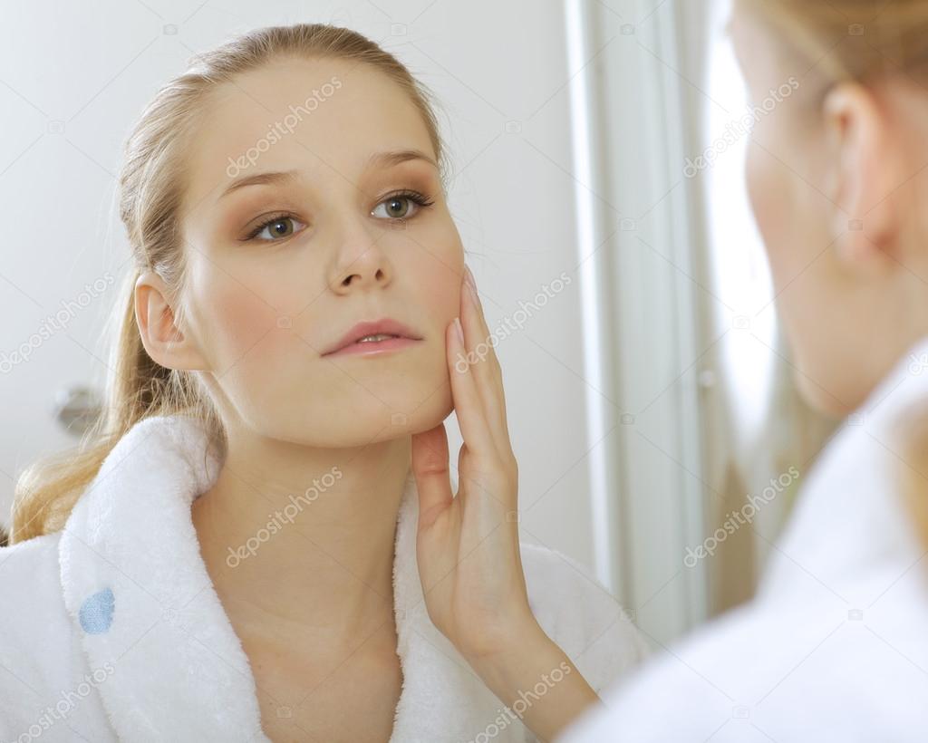 Woman reflaction in mirror