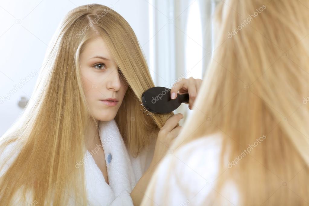 Woman brushing hair